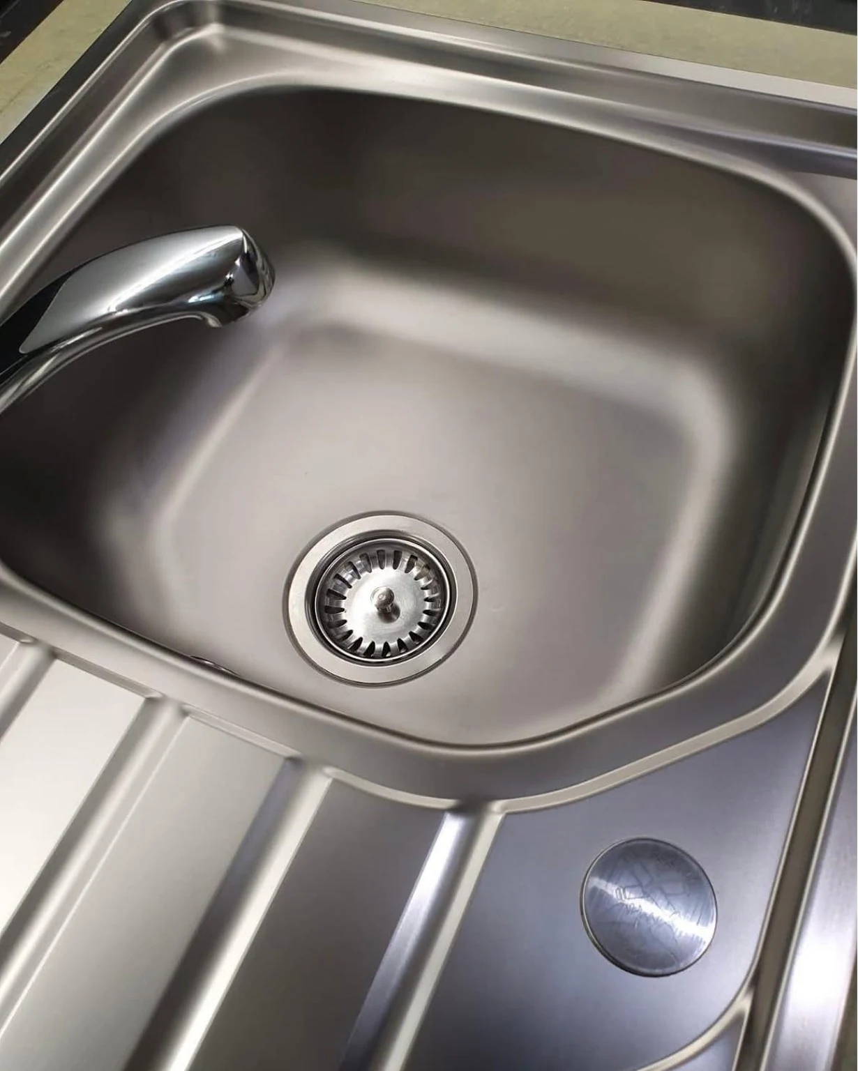 Stainless steel sink after refinishing